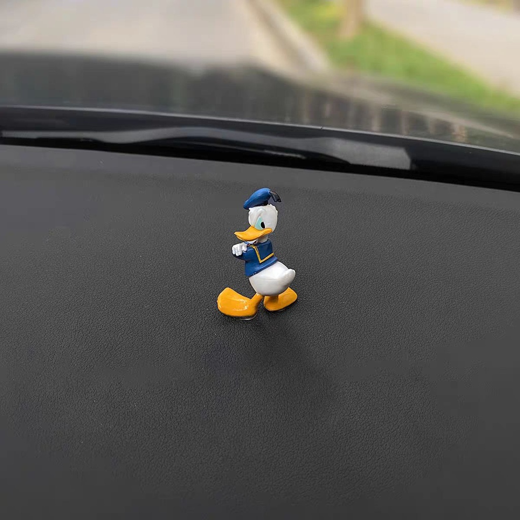 إكسسوار بتصميم بطوط لتزين تابلوه السيارة